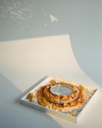 a plate of waffles with a clock on it