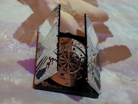 an image of a clock with a mirror on it
